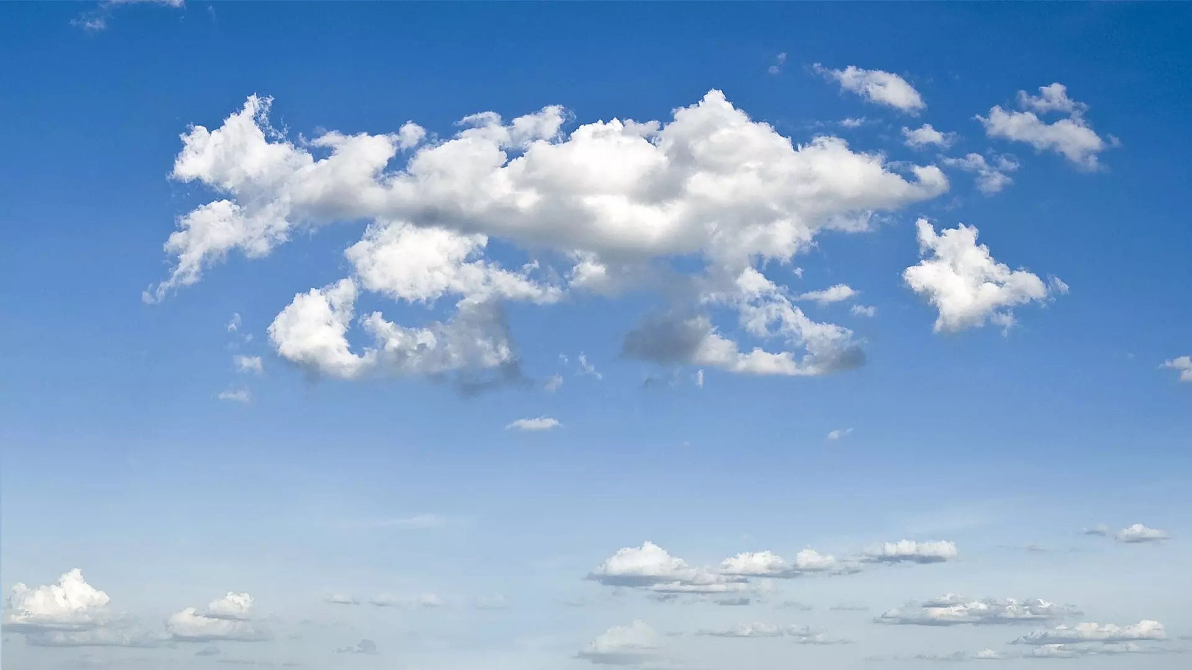 Blue sky fluffy clouds